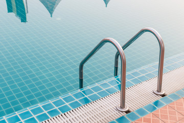 Outdoor swimming pool with stainless steel stair