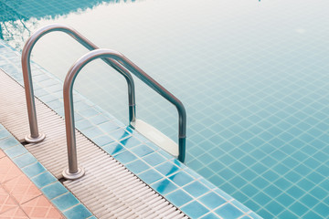 Outdoor swimming pool with stainless steel stair
