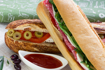 2 different types of fresh sandwiches.