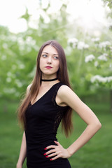 Fototapeta premium portrait of pretty young classic style woman in black dress