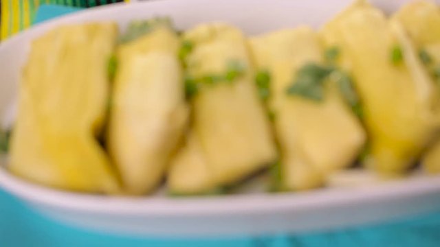 Home made tamales on serving plate on the party table