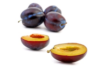 Plums isolated on white background. Fresh and dried.