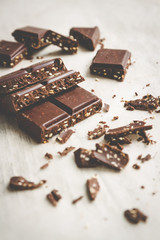 dark chocolate with sesame over rustic table