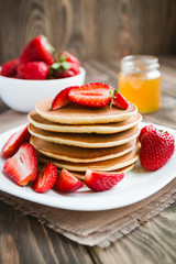 Stack of pancakes with strawberries