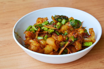 Fototapeta premium spicy stir fried pork tendon with herb on bowl