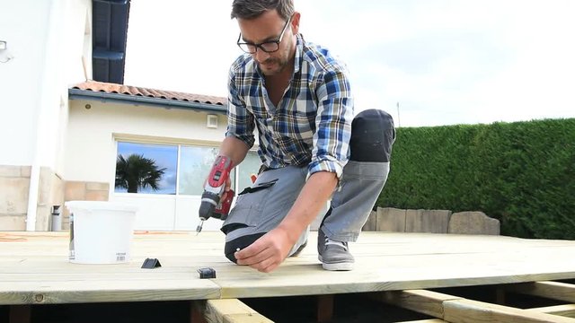 Carpenter building wooden deck