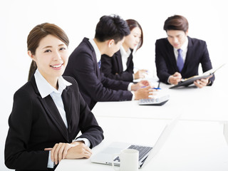 businesswoman with business people having meeting together