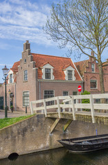 Fototapeta premium Small wooden bridge over a canal in Medemblik