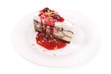Slice of ice cream cake with jam isolated 