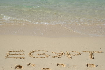 Egypt 2016 words written on raw sand  at beach