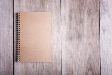 Top view of book on old wooden plank