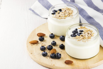 Yogurt with blueberry on a white background