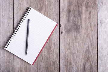 Top view of book on old wooden plank