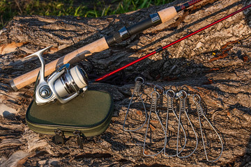 Fishing rod and reel on the natural background. 