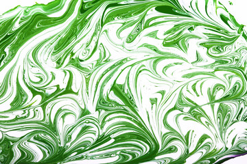 Green and white paint mixing.