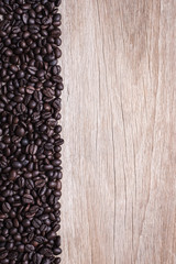 Coffee beans on wooden background, Composition with free space o