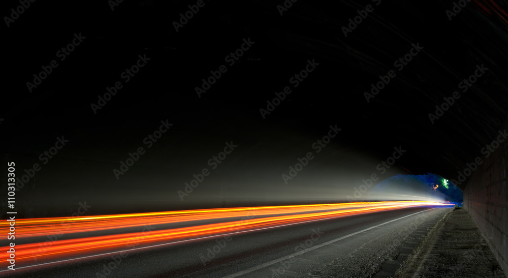 Wall mural light trails in tunnel