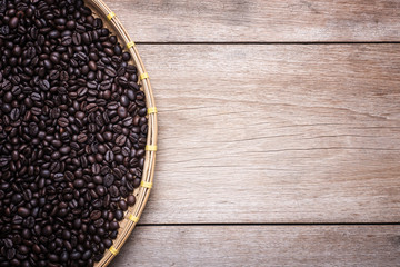 Coffee beans on wooden background, Composition with free space o