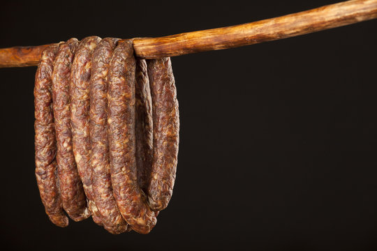 hanging smoked domestic traditional sausage