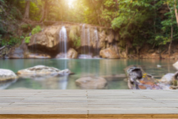 Wooden plank and background with Blur Waterfall