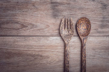Palm wood spoon on wooden table top view