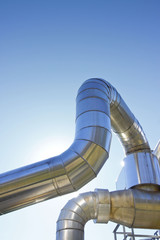 Geothermal power pipe structure against a blue background 