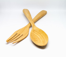 Wooden spoon, fork on white background