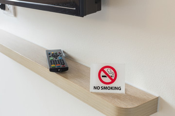 NO SMOKING Sign on the bed in hotel room