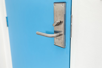 Stainless steel door handle in hotel