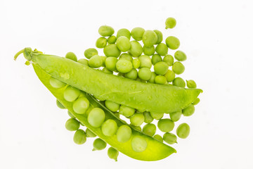 Wet fresh green peas, isolated on white background