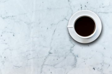 White coffee cup on stone table background top view