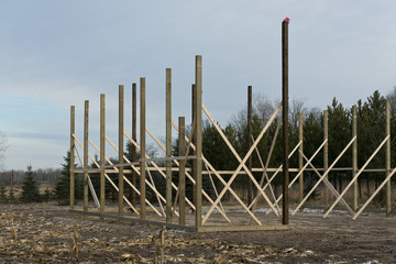 A pole barn under construction