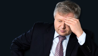 Man having splitting headache.