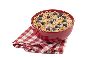 breakfast bowl of corn flakes rings and berries.