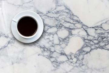 White coffee cup on stone table background top view