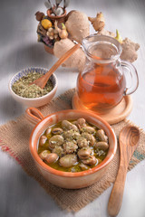 earthenware dish with beans cooked in olive oil and oregano