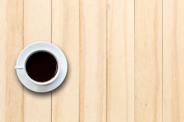 White coffee cup on wooden table top view