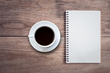 White coffee cup on wooden table top view