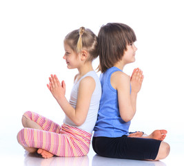 Obraz na płótnie Canvas Kids practice yoga