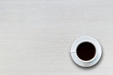 White coffee cup on wooden table top view