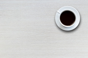 White coffee cup on wooden table top view