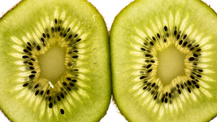 Two kiwi slices on white background