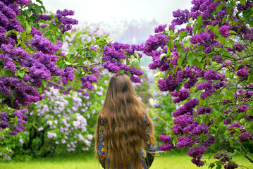 Girls in lilac garden