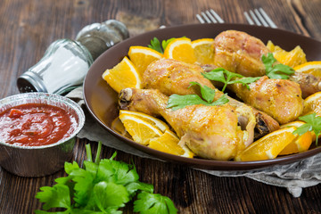 Fried chicken legs with orange