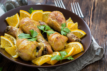 Fried chicken legs with orange