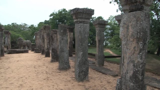 View to the stone columns and ruins of the ancient building in Polonnaruwa, Sri Lanka. Polonnaruwa is a UNESCO World Heritage site.