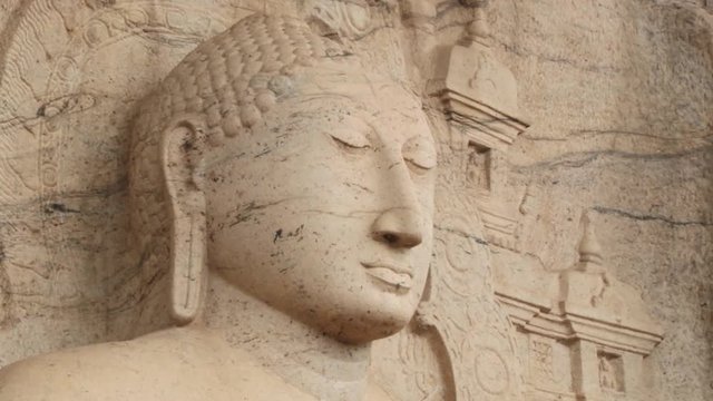 Buddha statue carved in stone in the ancient city of Polonnaruwa, Sri Lanka.
