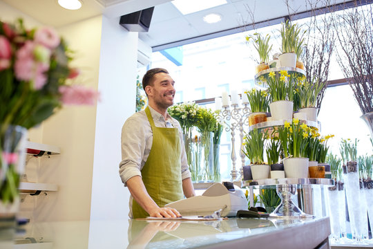 Florist Man Or Seller At Flower Shop Counter