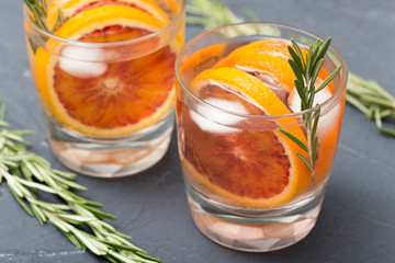fresh homemade lemonade with red oranges and rosemary