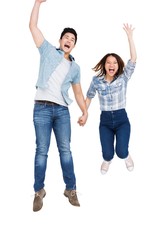 Obraz premium Excited young couple holding hands and jumping
